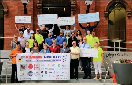  ?? DANIELLE RAY PHOTOS / SENTINEL & ENTERPRISE ?? Sponsors gather at Fitchburg City Hall last week to present checks to support the Fitchburg Civic Days ahead of the annual multiday event that takes place this weekend.