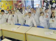  ??  ?? Induction Beaconhurs­t J6 pupils make DNA pendants during a visit to the science department