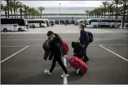  ?? FRANCISCO UBILLA — THE ASSOCIATED PRESS ?? Passengers wearing face masks arrive at Palma de Mallorca Airport on the Spanish Balearic Island of Mallorca, Spain, on Saturday.