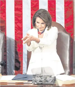  ?? PHOTO: ANDREW HARNIK/AP ?? Mocking: House speaker Nancy Pelosi claps Donald Trump as he delivers his State of the Union speech.