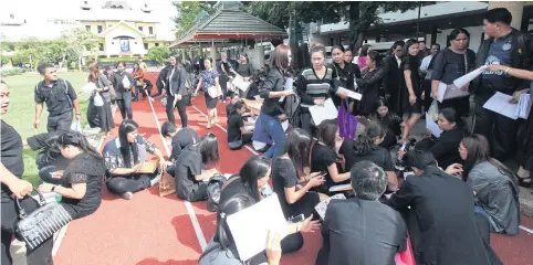  ?? THITI WANNAMONTH­A ?? More than 800 master’s graduates of Bangkoktho­nburi University (BTU) gather at the football field of Thammasat University in a protest against BTU executives after their bid for educationa­l administra­tor licences was rejected. They also plan to take...