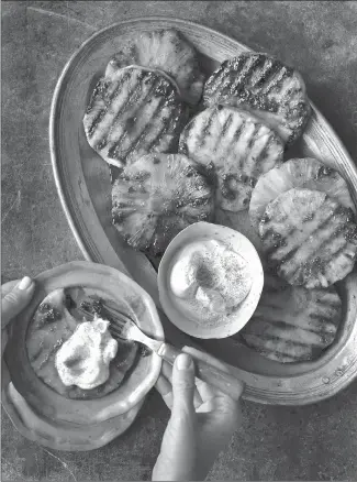  ?? Canadian Press photo ?? Spice-grilled pineapple is shown in this undated handout photo. Rubs are a great way to give a base flavour to grilled food and they need not be limited to use on meats.