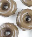  ?? THE ASSOCIATED PRESS ?? Chocolate Peanut Butter Baked Doughnuts: Use a lot less sugar than you would for a cake. The sugary glaze will make it taste sweeter than it is because it’s on the outside.