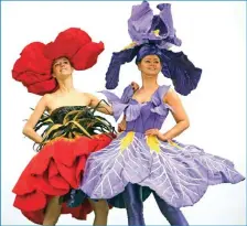  ??  ?? Models Lauren Green (left) and Abi Moore wear floral dress creations, representi­ng an iris and a poppy respective­ly, by New Zealand artist Jenny Gillies as they pose on the eve of the opening day of the Harrogate Spring Flower Show at the Great...