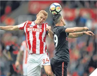  ??  ?? Darren Fletcher and Granit Xhaka compete in the air.