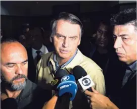  ?? AP ?? Jair Bolsonaro (centro) es favorito, según las encuestas, para ganar la segunda ronda electoral en Brasil, el 28 de octubre.