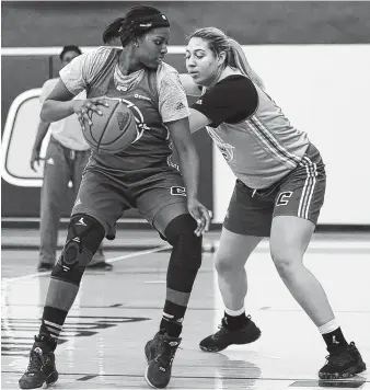  ?? STAFF FILE PHOTO BY C.B. SCHMELTER ?? UTC’s Arianne Whitaker, left, is guarded by fellow forward Ashlyn Wert during practice on Tuesday.