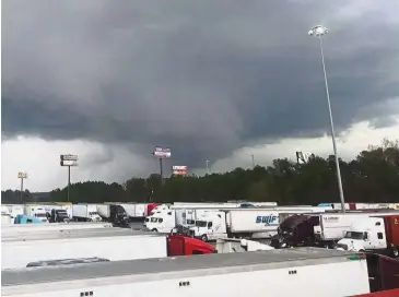  ?? — Reuters ?? Storm’s coming: A view of the tornado seen in the distance at Warner Robins, Georgia, in a picture obtained from social media.