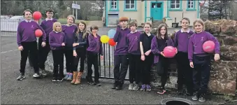  ??  ?? Pupils returning to Kilmory gather outside the school.