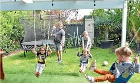  ??  ?? Swings attached to the pergola in Dan MacKay’s garden are multi-functional.