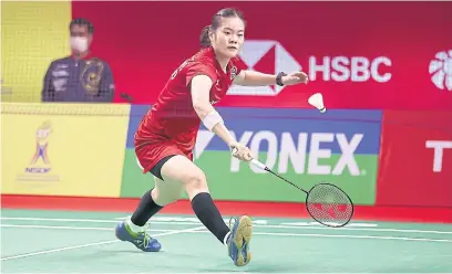  ??  ?? Busanan Ongbamrung­phan plays a shot during her second round match against Saina Nehwal.