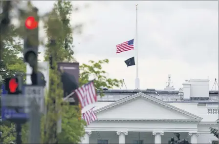  ?? SUSAN WALSH — THE ASSOCIATED PRESS ?? The American flag flies at half-staff over the White House in Washington, Friday, April 16.