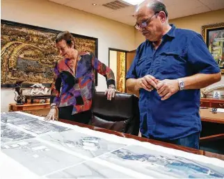  ?? Michael Ciaglo / Houston Chronicle ?? Gorham Group CEO Marlene Sarres and project director Mario Monetta look over plans for a fertilizer plant. Sarres relies on the H1B visa program to get Argentine engineers.