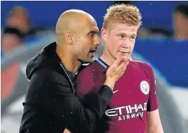  ?? /Reuters ?? Recognitio­n: Match winner Kevin De Bruyne gets the ‘my beauty’ treatment from Manchester City manager Pep Guardiola after the win over Chelsea on Saturday.