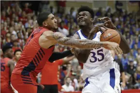  ?? MARCO GARCIA - THE ASSOCIATED PRESS ?? FILE - In this Nov. 27, 2019, file photo, Dayton forward Obi Toppin (1) knocks the ball away from Kansas center Udoka Azubuike (35) during the first half of an NCAA college basketball game in Lahaina, Hawaii.