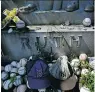  ?? THE ASSOCIATED PRESS ?? Fans still leave bats, balls, beer and other items on Babe Ruth’s grave in Hawthorne, N.Y.