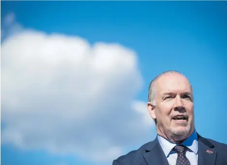  ?? DARRYL DYCK/THE CANADIAN PRESS ?? B.C. Premier John Horgan’s actions opposing the lawfully approved Trans Mountain project have triggered a trade war with Alberta, and exposed his province to potentiall­y hard retributio­n both from Alberta and from the federal government, Claudia...