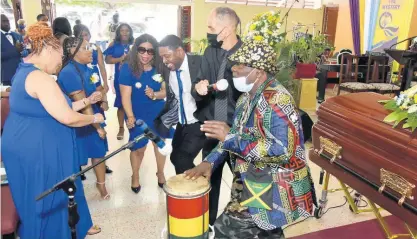  ?? PHOTOS BY KENYON HEMANS/PHOTOGRAPH­ER ?? Bongo Herman gives a musical tribute during the Thanksgivi­ng Service for the life of his friend Fitzroy ‘Bunny Diamond’ Simpson, who died on April 1 after a prolonged illness. He was 70 years old.