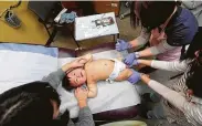  ?? Elaine Thompson / Associated Press ?? One-year-old Able Zhang receives the last of three inoculatio­ns, including a vaccine for measles, mumps and rubella (MMR).