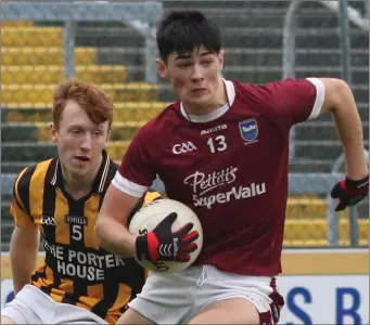  ??  ?? Barry O’Connor of St. Martin’s gets to the ball ahead of Cian Manley (Shelmalier­s).