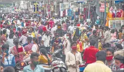  ?? PTI ?? Besant Road in Vijayawada is thronged with people on Sunday.