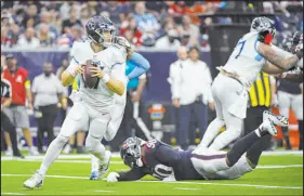  ?? Justin Rex The Associated Press ?? Tennessee Titans quarterbac­k Ryan Tannehill threw for 3,734 yards and 21 touchdowns while leading the AFC’S No. 1 playoff seed.