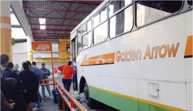  ?? PICTURE: SOPHIA STANDER ?? TOUGH TRADING: Passengers getting on board a Golden Arrow bus at the bus terminus at the Grand Parade in this file photo. Golden Arrow announced yesterday it would be increasing its fares as of December 25.