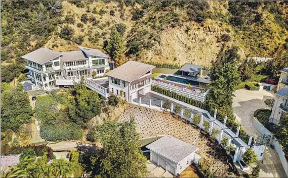  ?? Photograph­s by Noel Kleinman ?? STRETCHING ACROSS a two-acre hillside lot, this newly built Bel-Air home is being leased by rapper Tyga for $58,000 a month.