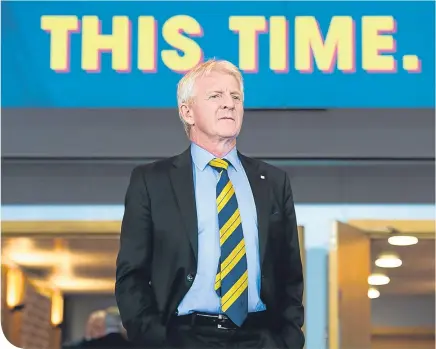  ??  ?? Gordon Strachan last Thursday night, shadowed by a message all Scotland fans hope will come true