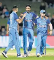  ?? ANI ?? Mohammed Siraj (C) took four wickets in Napier on Tuesday.