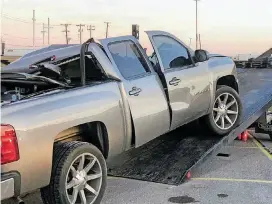  ?? [PHOTO BY ROBERT MEDLEY, THE OKLAHOMAN] ?? This pickup was struck by a loose dual wheel set Monday on Interstate 40 in west Oklahoma City. The woman driving the pickup was killed, the Oklahoma Highway Patrol reported.