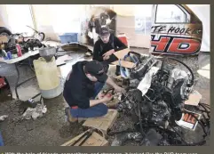  ??  ?? With the help of friends, competitor­s, and strangers, it looked like the DHD team was going to be able to replace their fried engine and ECM, swap axles, change to a triple-turbo setup, and make the call to the sled pull!