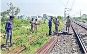  ?? ?? Officials and RPF personnel inspect the signal box which was tampered with near Tirupattur railway station