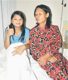  ??  ?? Susanti Daba of Kampung Pangkalan Jawa, Limbang accompanie­d by her mum, is among the 347 patients who have undergone the cleft lip and palate corrective surgery thanks to the charity project.