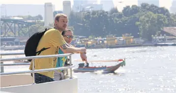  ?? APICHART JINAKUL ?? Tourists on a cruise on the Chao Phraya River. An increase in foreign tourist arrivals has resulted in higher consumer confidence.