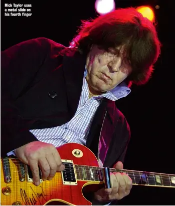  ??  ?? Mick Taylor uses a metal slide on his fourth finger