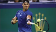  ??  ?? Rafael Nadal of Spain hits a forehand shot against Jared Donaldson of the United States during their men’s singles match in the Shanghai Masters tennis tournament at Qizhong Forest Sports City Tennis Center in Shanghai, China, on Wednesday. AP...