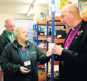  ??  ?? The Bishop of Liverpool, the Rt Rev Paul Bayes, at Southport Foodbank