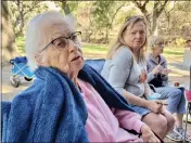  ?? PHOTO BY KIMBERLY K. FU, THE REPORTER ?? Cecilia Maloney, left, and her daughter Chris Closser, right, share family history at a reunion of descendant­s of Marcos Anastacio Vaca, the second oldest son of Juan Manuel Vaca, whom Vacaville is named for.