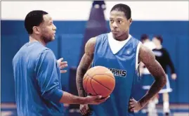  ?? Mark Weber/the Commercial Appeal ?? Memphis' Antonio Barton works out with assistant coach Damon Stoudamire (left) during practice at the Finch Center.