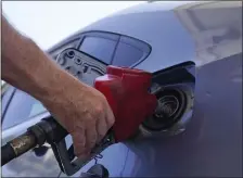  ?? THE ASSOCIATED PRESS FILE ?? POLITICAL COST: Just as Americans gear up for summer road trips, the price of oil remains stubbornly high, pushing prices at the gas pump to painful heights. That is likely to have an effect on November’s elections.
