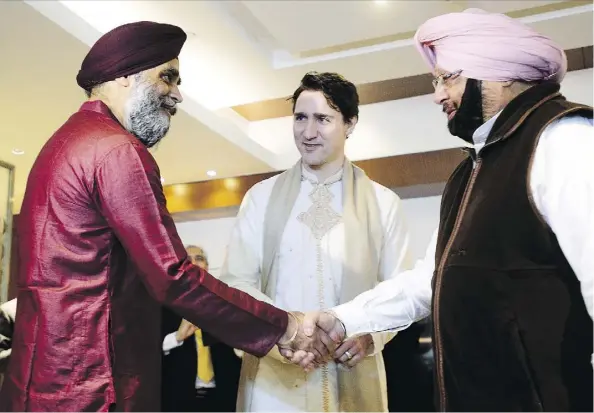  ?? SEAN KILPATRICK/THE CANADIAN PRESS ?? Prime Minister Justin Trudeau and Defence Minister Harjit Sajjan, left, meet with Chief Minister of Punjab Amarinder Singh in Amritsar, India, on Wednesday. Trudeau’s visit exhibits soft power — it’s not the dud it’s being made out to be, says Kevin...