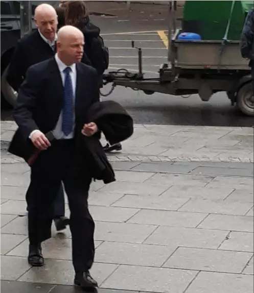  ??  ?? Garda Joe Evans with Superinten­dent Jim Delaney and Inspector Tom Colsh arriving at the Criminal Courts of Justice in Dublin.