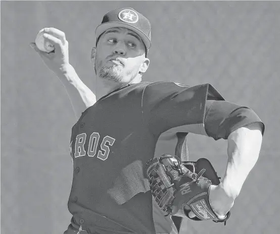  ?? Karen Warren photos / Houston Chronicle ?? Astros closer Ken Giles throws a bullpen session during spring training at The Ballpark of the Palm Beaches. He worked hard on his endurance in the offseason.