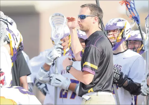  ?? Matthew Brown / Hearst Connecticu­t Media ?? Westhill boys lacrosse coach Scott Stone talks with his team during a 2017 game in Stamford. Stone is currently deployed overseas with the National Guard.