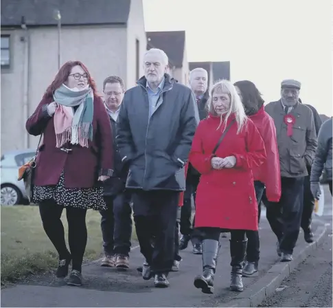  ??  ?? 0 Labour leader Jeremy Corbyn with party supporters and residents in Penicuik before a rally at the town’s Miners Welfare