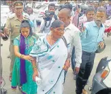  ??  ?? Family members of IPS officer Suresh Das in Kanpur. (Right) Officials outside Regency Hospital where Das was admitted.