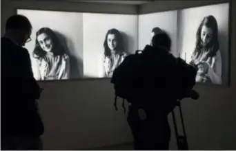  ?? PETER DEJONG — THE ASSOCIATED PRESS ?? Journalist­s take images of the renovated Anne Frank House Museum in Amsterdam, Netherland­s, Wednesday.