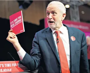  ??  ?? Jeremy Corbyn brandishes his party’s manifesto: a little red book with a big red price tag