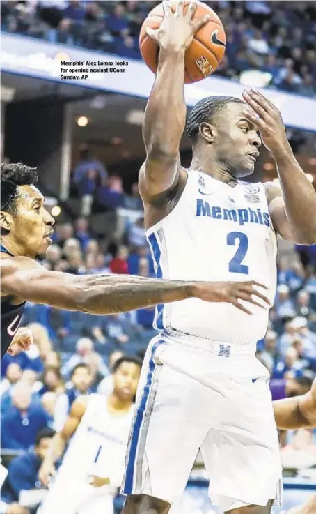  ?? AP ?? Memphis’ Alex Lomax looks for opening against UConn Sunday.